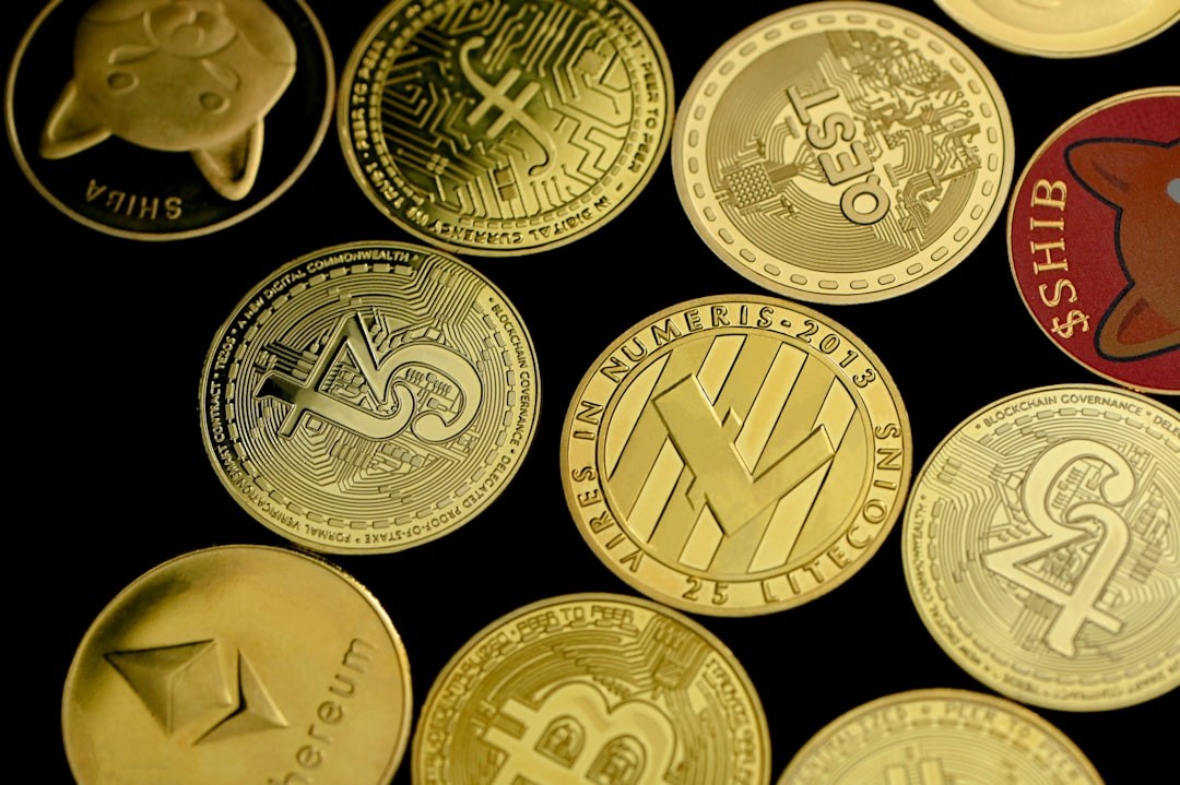 Various gold-colored cryptocurrency coins including Ethereum, Litecoin, and Shiba Inu on a black background.